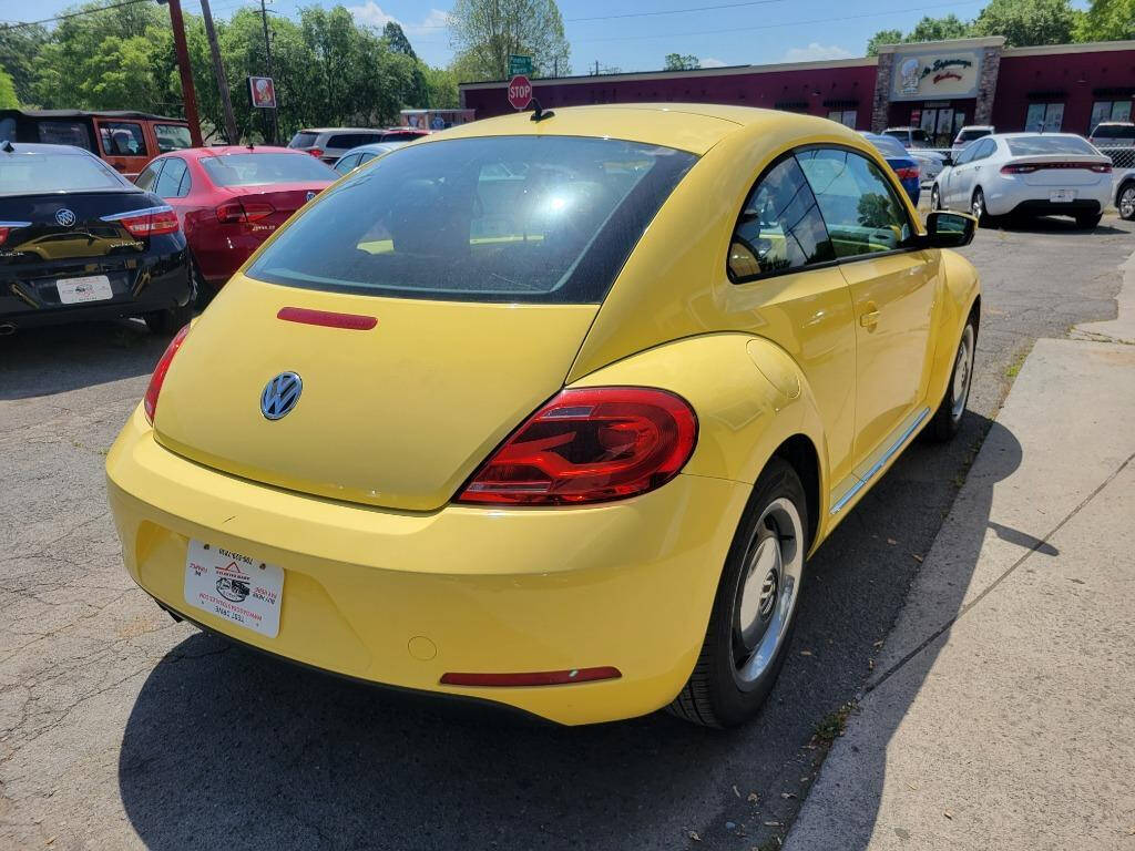 2012 Volkswagen Beetle for sale at DAGO'S AUTO SALES LLC in Dalton, GA