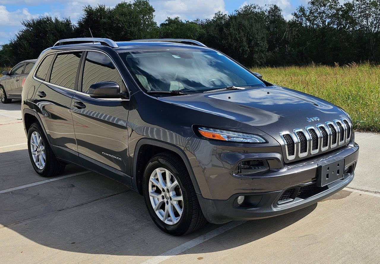 2017 Jeep Cherokee for sale at CAR MARKET AUTO GROUP in Sugar Land, TX