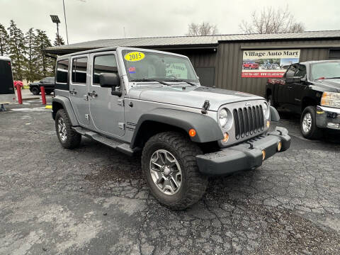 2015 Jeep Wrangler Unlimited for sale at VILLAGE AUTO MART LLC in Portage IN