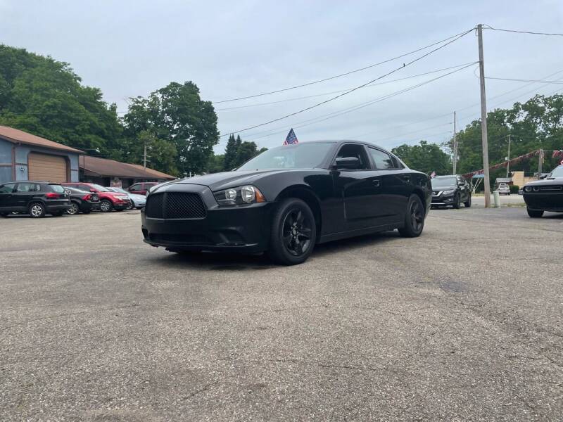 2014 Dodge Charger for sale at Rombaugh's Auto Sales in Battle Creek MI