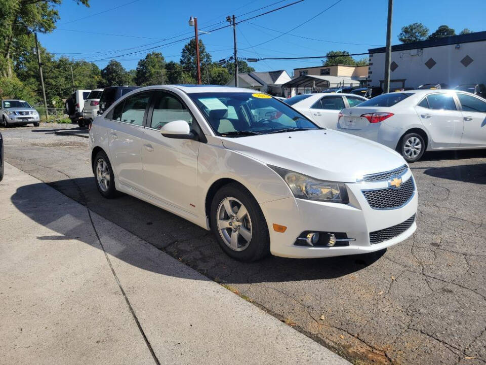 2013 Chevrolet Cruze for sale at DAGO'S AUTO SALES LLC in Dalton, GA