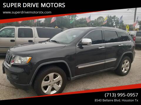 2011 Jeep Grand Cherokee for sale at SUPER DRIVE MOTORS in Houston TX