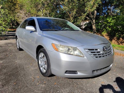 2009 Toyota Camry for sale at DELRAY AUTO MALL in Delray Beach FL