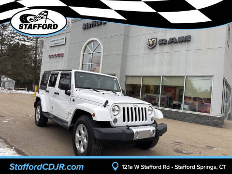 2015 Jeep Wrangler Unlimited for sale at International Motor Group - Stafford CDJR in Stafford Springs, CT