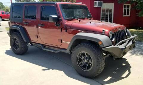 2010 Jeep Wrangler Unlimited for sale at CE Auto Sales in Baytown TX