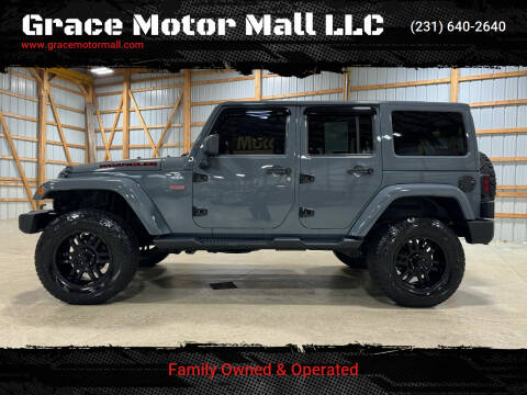 2014 Jeep Wrangler Unlimited for sale at Grace Motor Mall LLC in Traverse City MI
