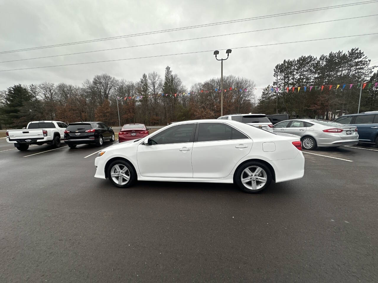 2014 Toyota Camry for sale at Auto Hunter in Webster, WI