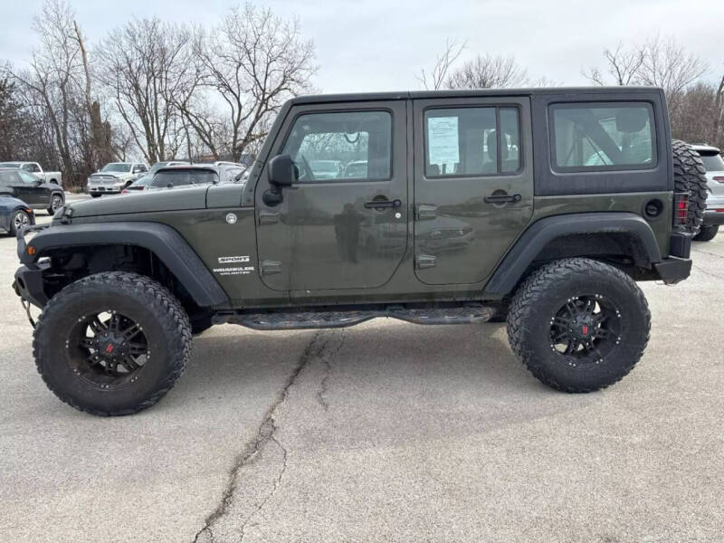 2015 Jeep Wrangler Unlimited for sale at VINE STREET MOTOR CO in Urbana IL