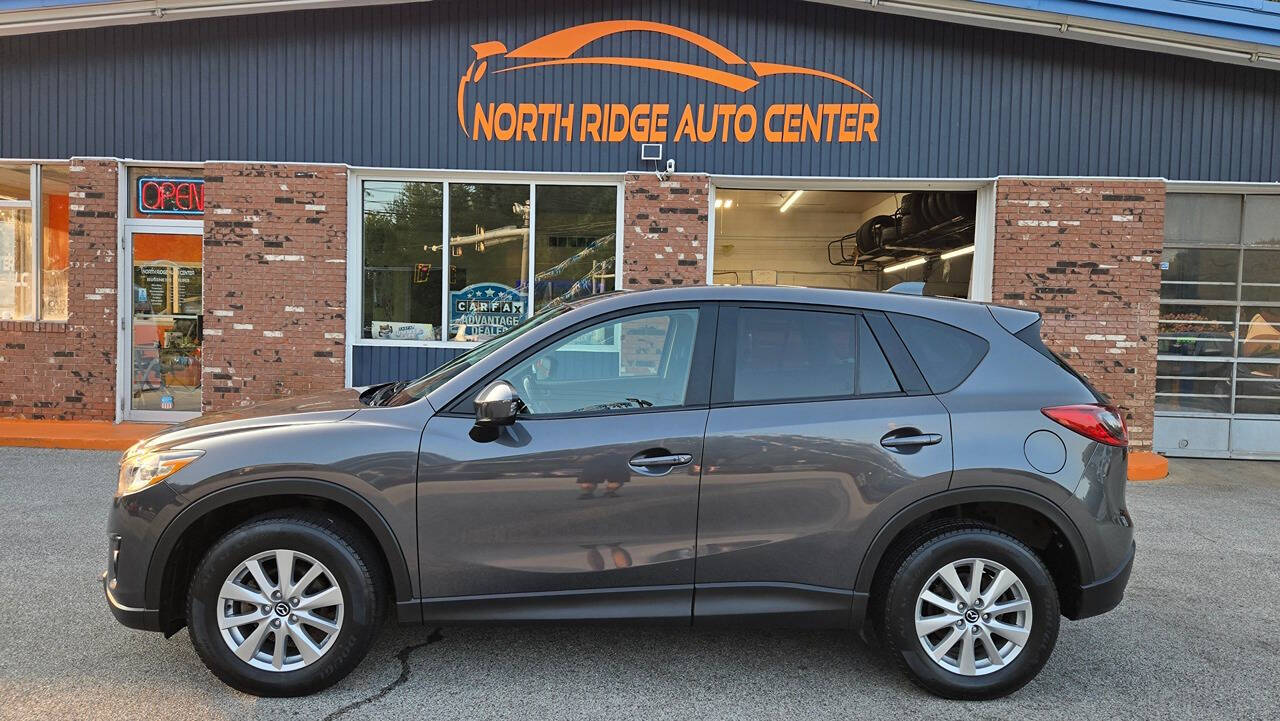 2015 Mazda CX-5 for sale at North Ridge Auto Center LLC in Madison, OH