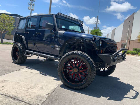 2013 Jeep Wrangler Unlimited for sale at AUTO BURGOS in Hollywood FL