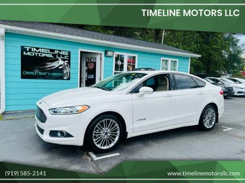 2014 Ford Fusion Hybrid for sale at Timeline Motors LLC in Clayton NC