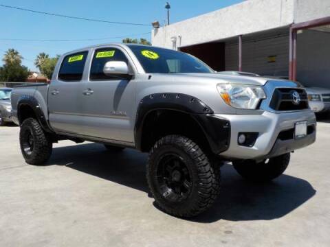 2014 Toyota Tacoma for sale at Bell's Auto Sales in Corona CA