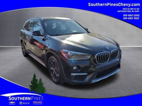 2017 BMW X1 for sale at PHIL SMITH AUTOMOTIVE GROUP - SOUTHERN PINES GM in Southern Pines NC