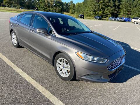 2014 Ford Fusion for sale at Carprime Outlet LLC in Angier NC