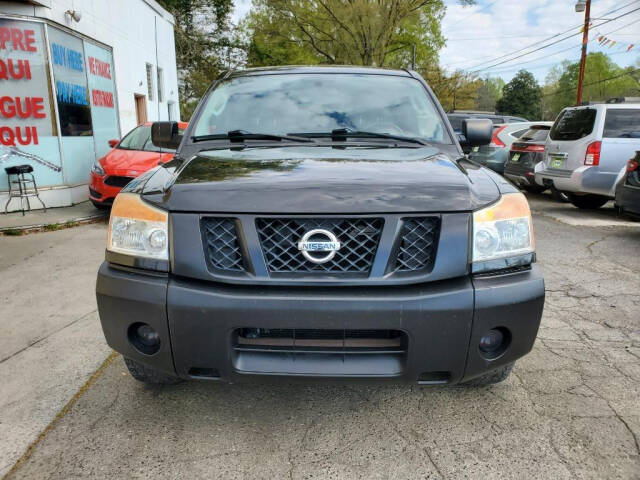 2011 Nissan Titan for sale at DAGO'S AUTO SALES LLC in Dalton, GA