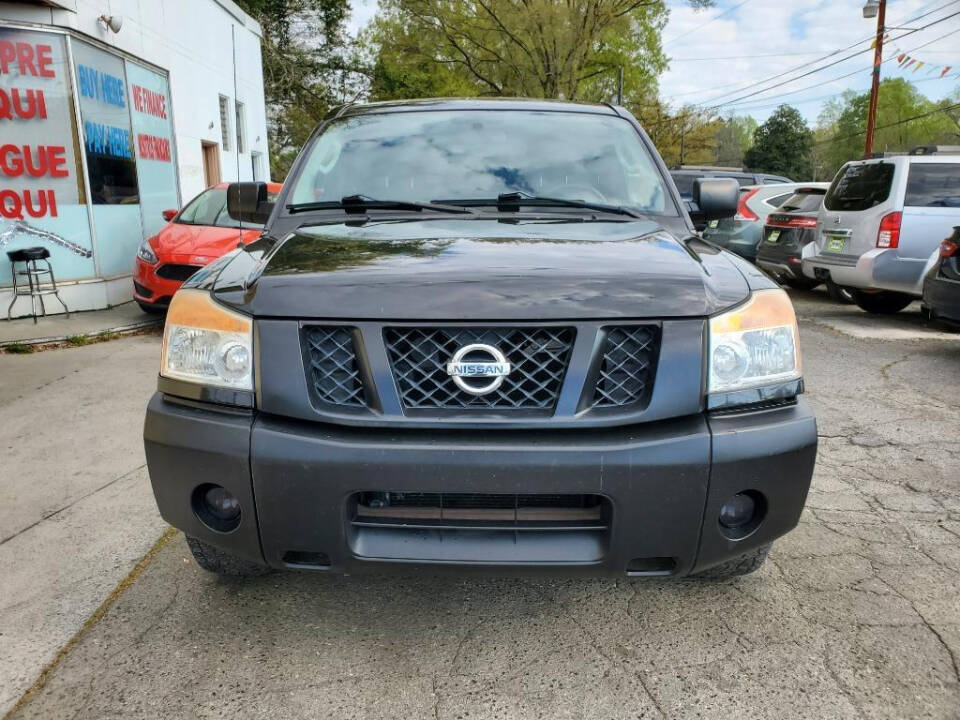 2011 Nissan Titan for sale at DAGO'S AUTO SALES LLC in Dalton, GA