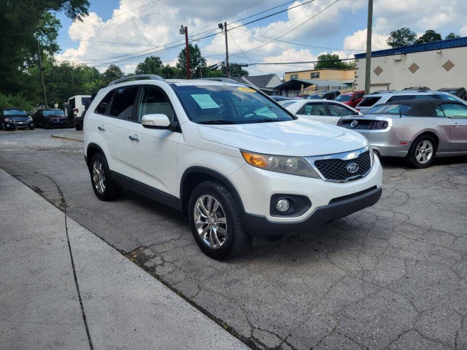 2011 Kia Sorento for sale at DAGO'S AUTO SALES LLC in Dalton, GA