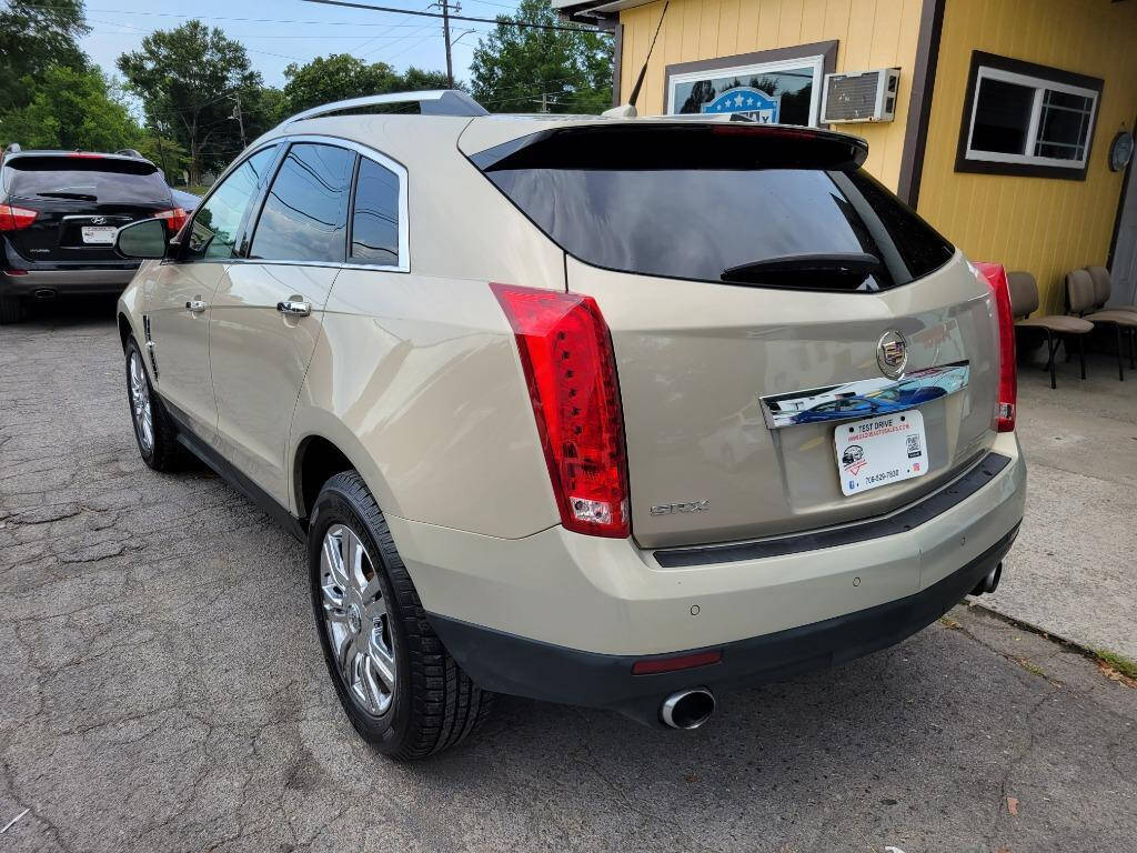 2011 Cadillac SRX for sale at DAGO'S AUTO SALES LLC in Dalton, GA