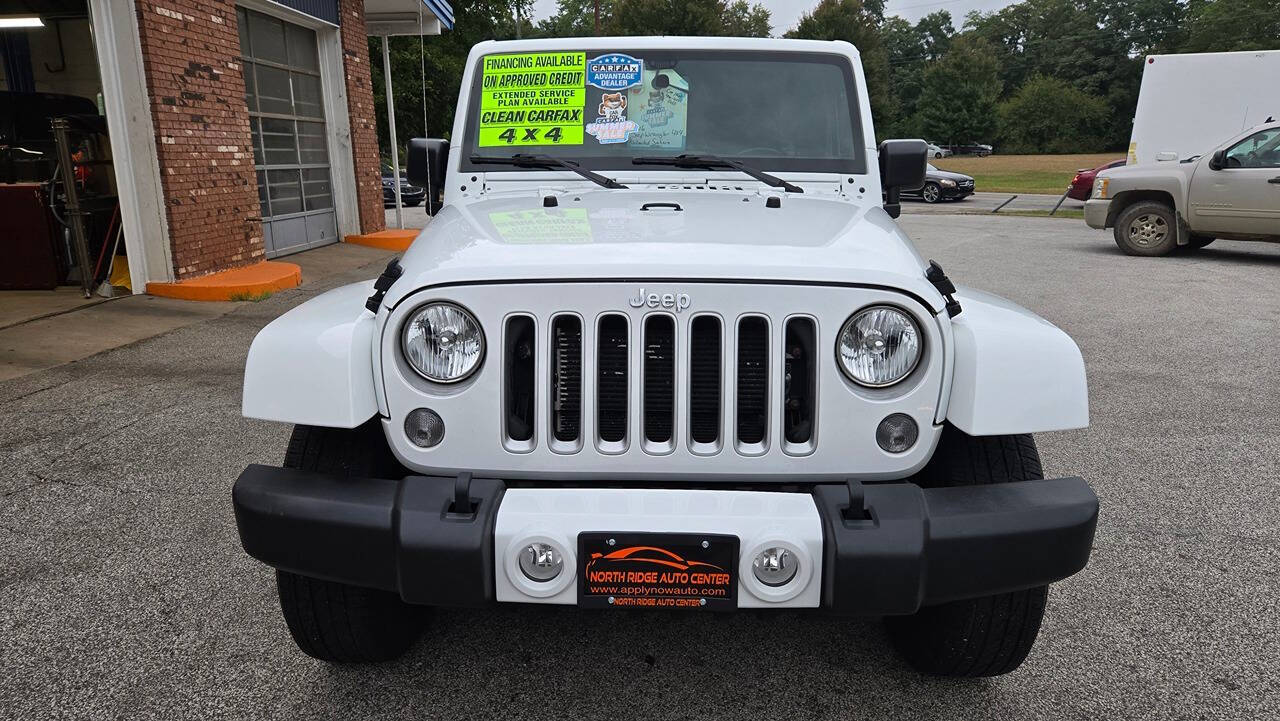 2016 Jeep Wrangler Unlimited for sale at North Ridge Auto Center LLC in Madison, OH