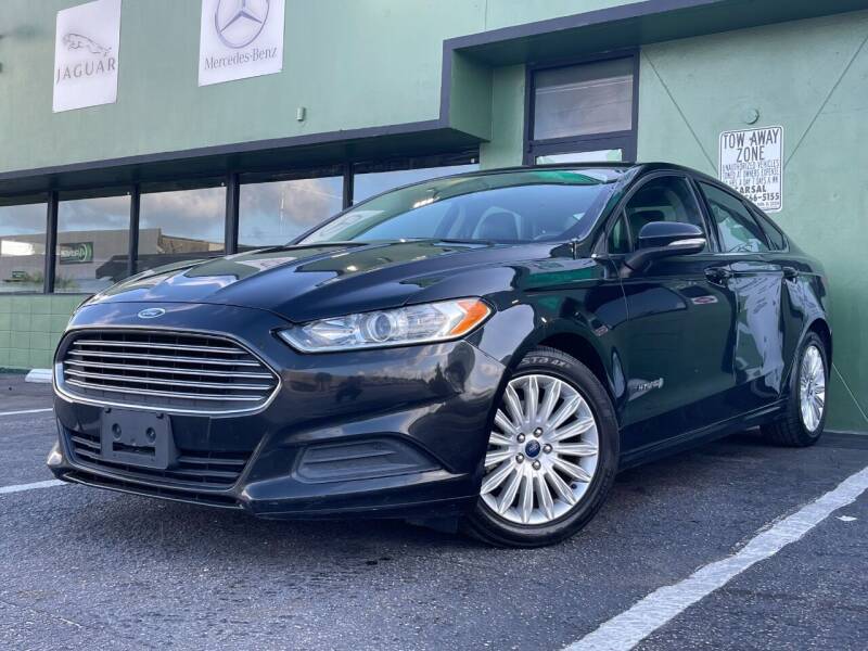2014 Ford Fusion Hybrid for sale at KARZILLA MOTORS in Oakland Park FL