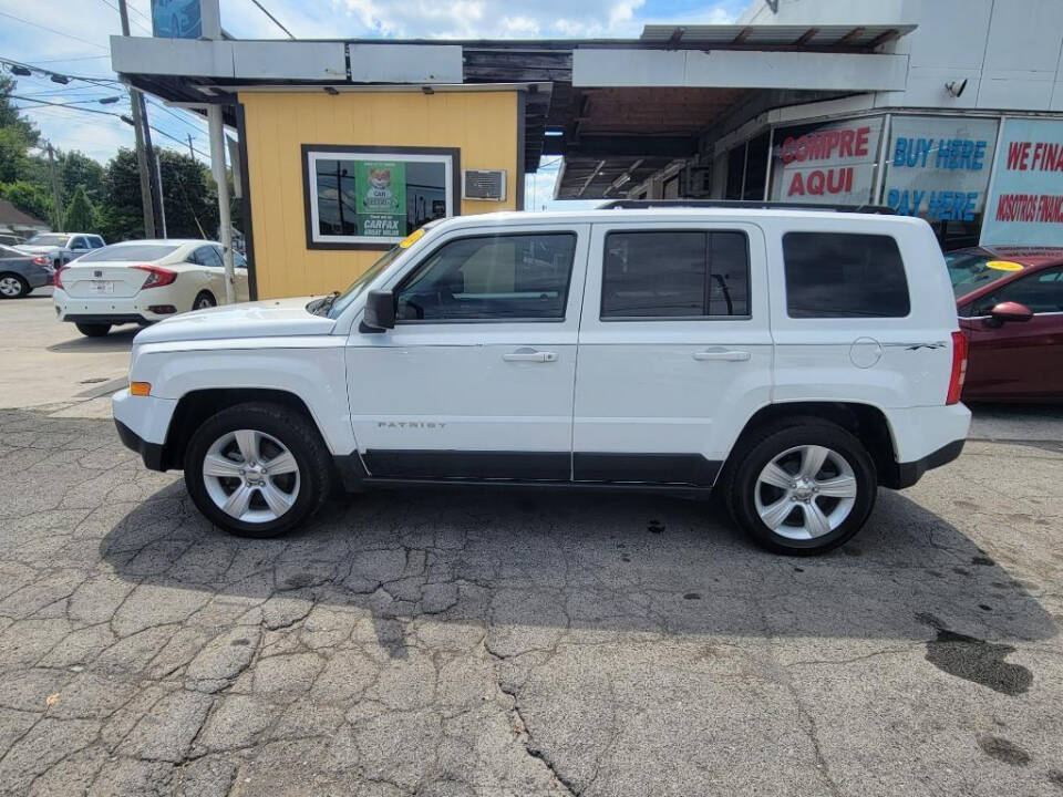 2014 Jeep Patriot for sale at DAGO'S AUTO SALES LLC in Dalton, GA