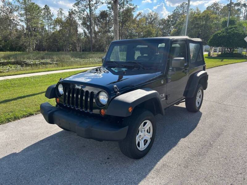 2009 Jeep Wrangler for sale at CLEAR SKY AUTO GROUP LLC in Land O Lakes FL