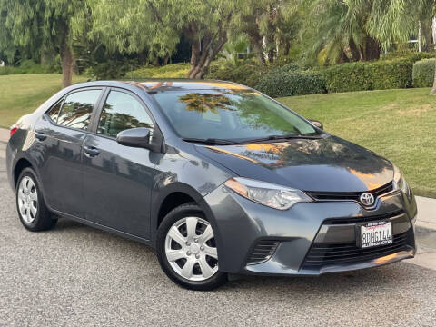 2015 Toyota Corolla for sale at MILLENNIUM MOTORS in Van Nuys CA