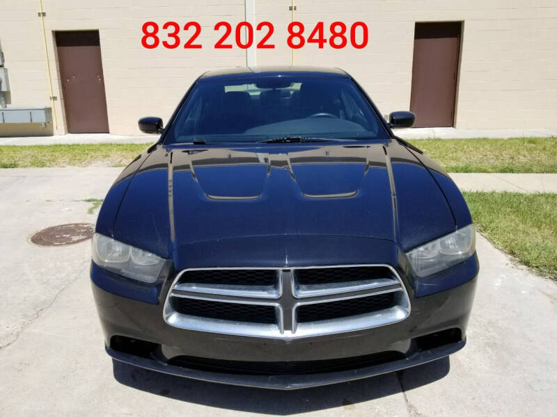 2014 Dodge Charger for sale at Hispanos Cars 4 Less by Cadena Motors, Inc. in Houston TX