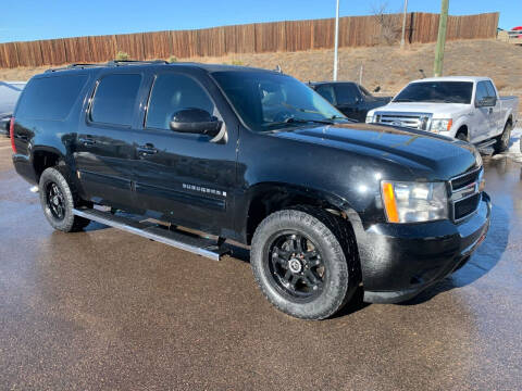 2014 Chevrolet Suburban for sale at McManus Motors in Wheat Ridge CO