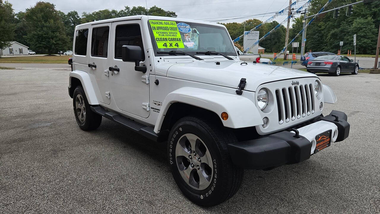 2016 Jeep Wrangler Unlimited for sale at North Ridge Auto Center LLC in Madison, OH