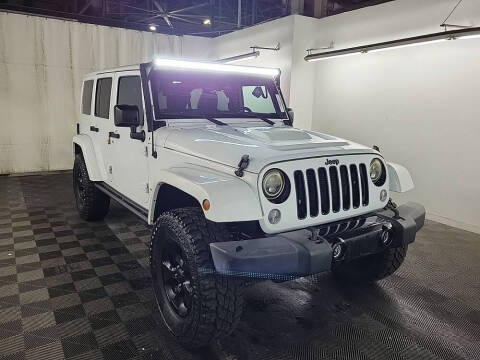 2015 Jeep Wrangler Unlimited for sale at Route 106 Motors in East Bridgewater MA