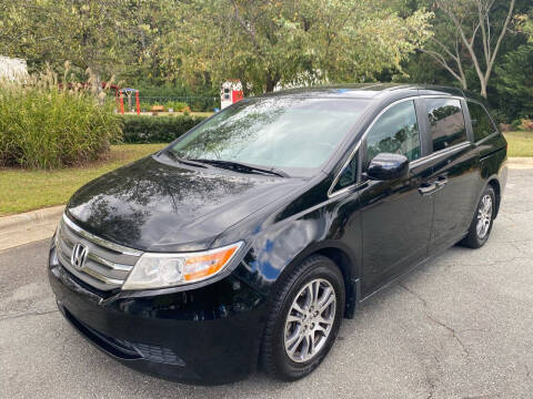 2012 Honda Odyssey for sale at Triangle Motors Inc in Raleigh NC