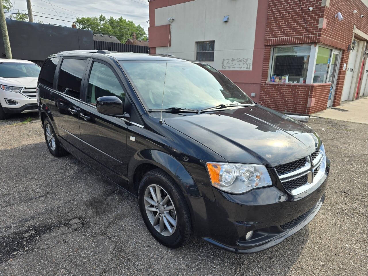 2014 Dodge Grand Caravan for sale at TMY AUTO in Detroit, MI