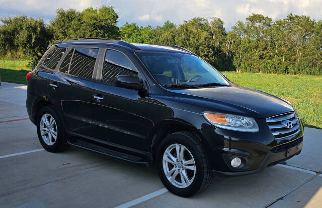 2012 Hyundai SANTA FE for sale at CAR MARKET AUTO GROUP in Sugar Land, TX