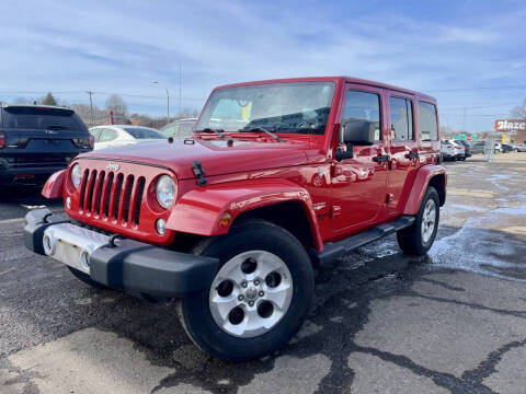 2014 Jeep Wrangler Unlimited for sale at Auto Tech Car Sales in Saint Paul MN