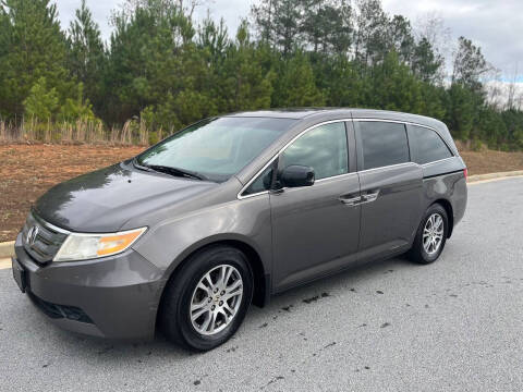 2011 Honda Odyssey for sale at FALCONS AUTOMOTIVE LLC in Buford GA