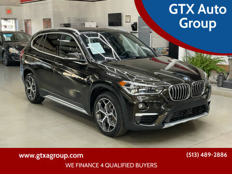 2017 BMW X1 for sale at GTX Auto Group in West Chester OH