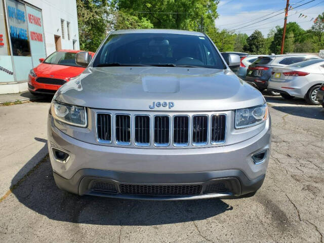 2014 Jeep Grand Cherokee for sale at DAGO'S AUTO SALES LLC in Dalton, GA