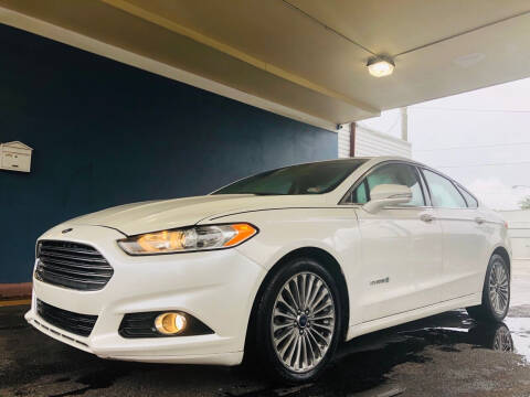 2014 Ford Fusion Hybrid for sale at Trimax Auto Group in Norfolk VA