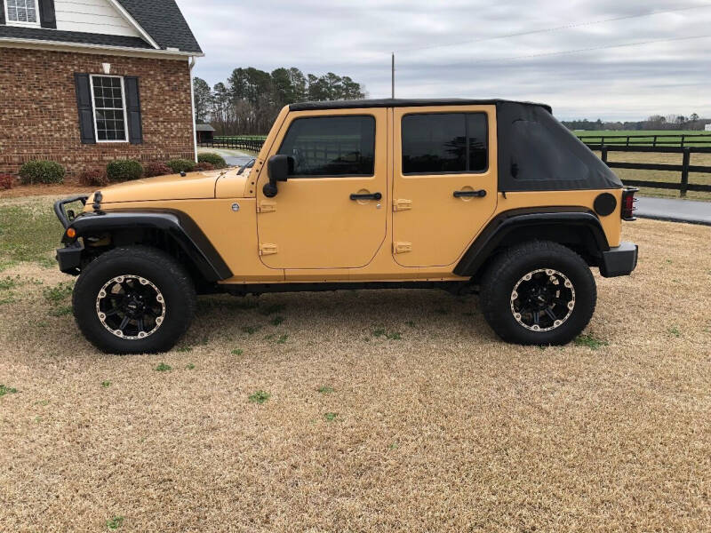 2013 Jeep Wrangler Unlimited for sale at Performance Auto Center Inc in Benson NC