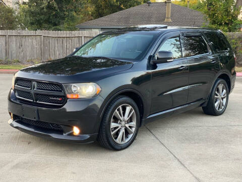 2013 Dodge Durango for sale at KM Motors LLC in Houston TX