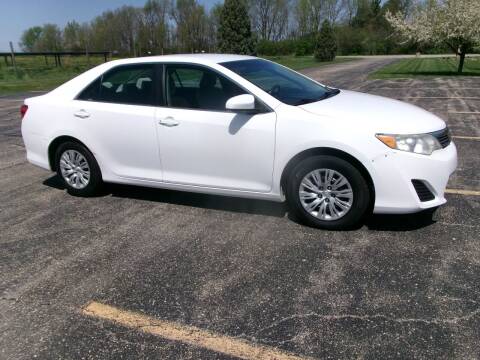 2014 Toyota Camry for sale at Crossroads Used Cars Inc. in Tremont IL