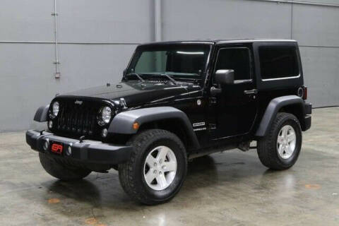 2014 Jeep Wrangler for sale at EA Motorgroup in Austin TX