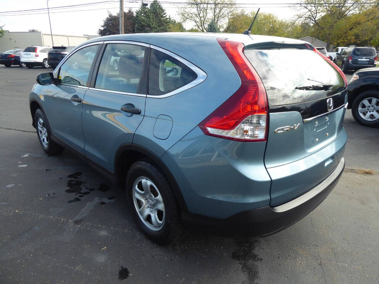 2014 Honda CR-V for sale at Lakeshore Autos in Holland, MI