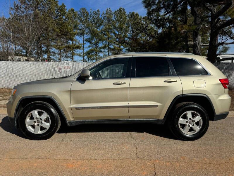 2011 Jeep Grand Cherokee for sale at Mandingo's Automotive & Sales LLC in Snellville GA