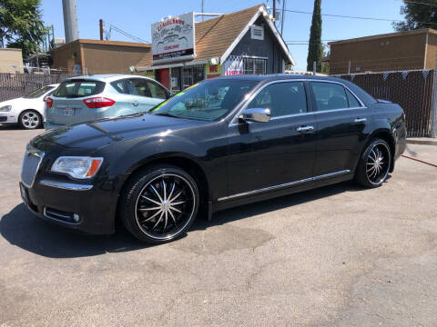 2014 Chrysler 300 for sale at C J Auto Sales in Riverbank CA