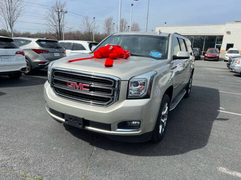 2015 GMC Yukon XL for sale at Charlotte Auto Group, Inc in Monroe NC
