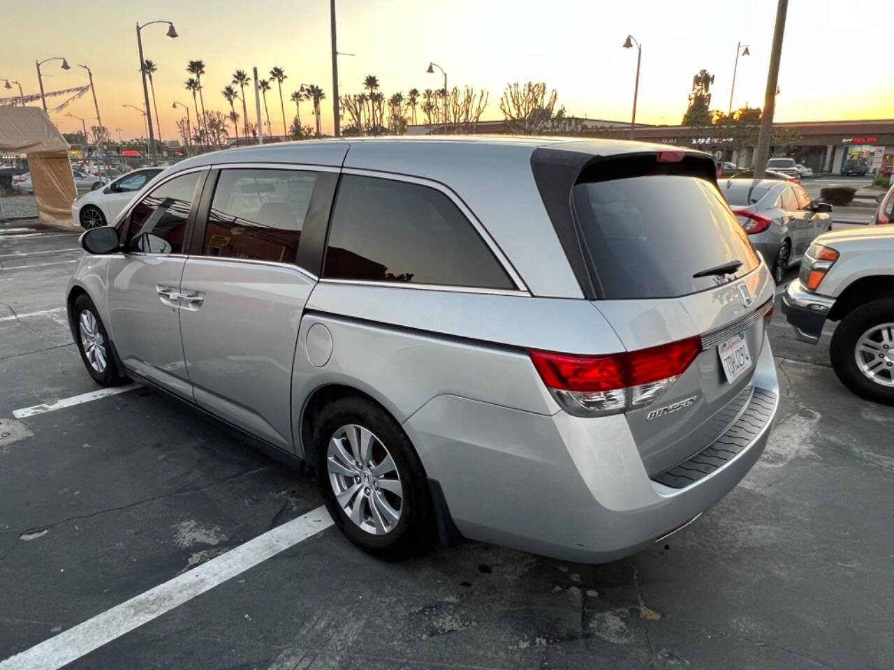 2014 Honda Odyssey for sale at Unique Auto Sales, Inc. in Bell, CA