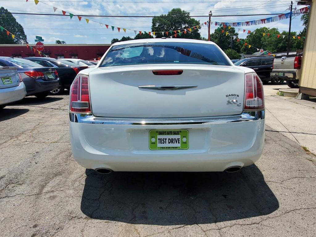 2014 Chrysler 300 for sale at DAGO'S AUTO SALES LLC in Dalton, GA