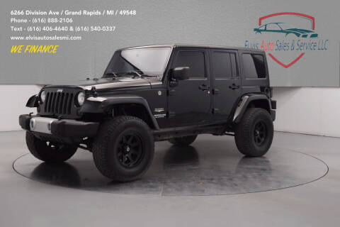 2011 Jeep Wrangler Unlimited for sale at Elvis Auto Sales LLC in Grand Rapids MI